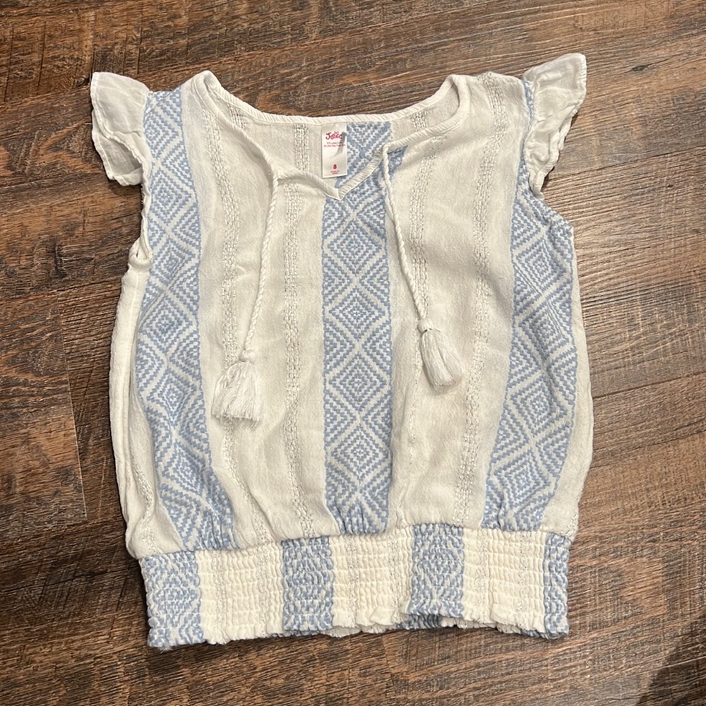 Justice Girl’s Size 8. Light Blue and white cinched bottom shirt.